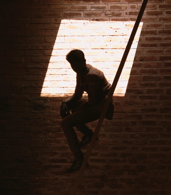 a man standing up on some stairs looking at the sky