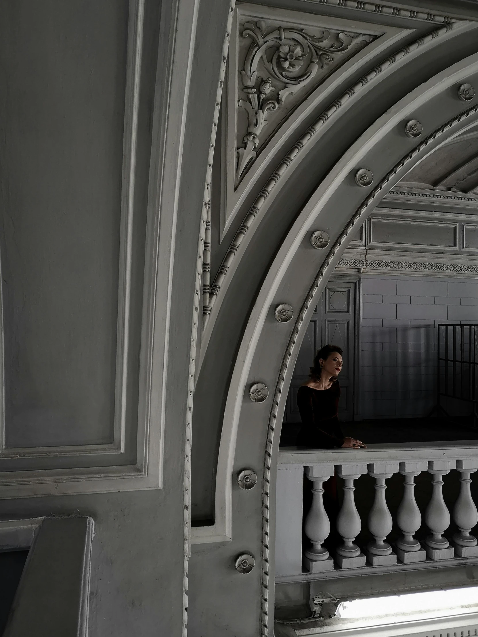 a woman is sitting at the top of some stairs