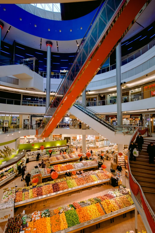 a large fruit section with stairs on the sides