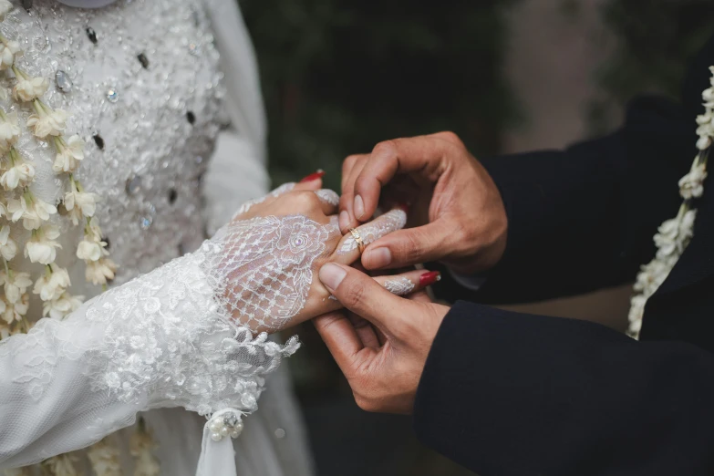 bride and groom hold hands on wedding day