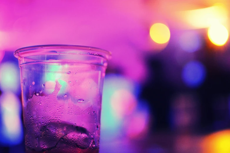 a glass of soda is sitting on a table