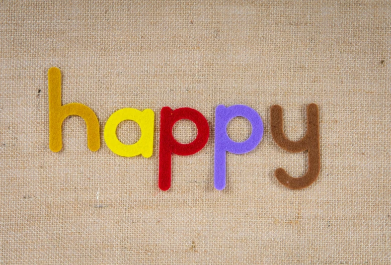 a picture of the word happy on the carpet