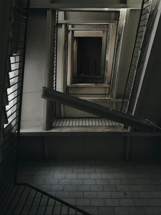 an industrial area with stairs, windows and doors