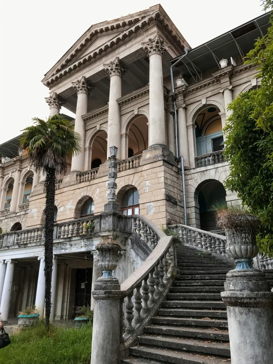 an elaborate building with white columns and columns