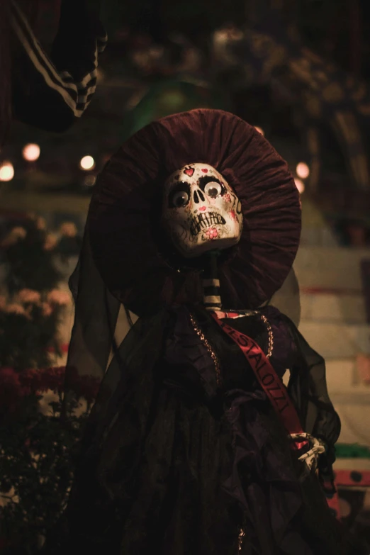 an elaborately decorated woman with long hair and hat