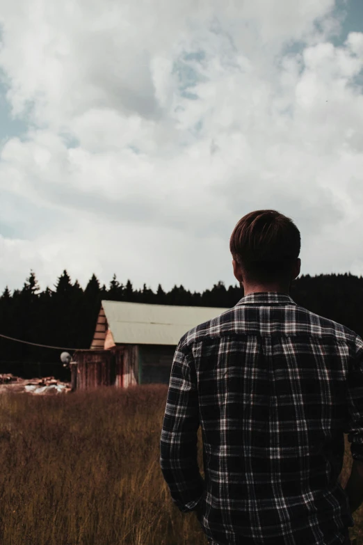 a man standing in the middle of a field