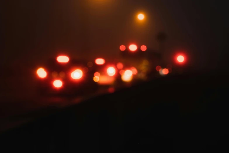 many cars are driving along the road at night