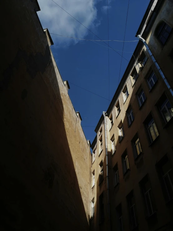 looking up at a small satellite system on top of some buildings