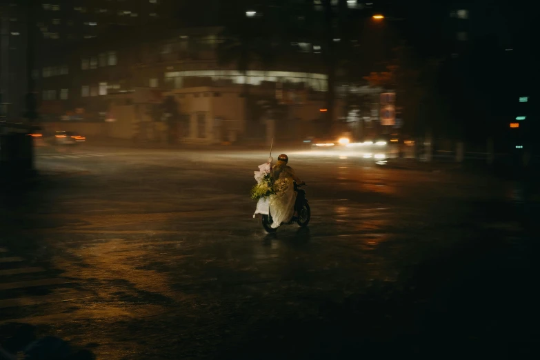 a person walking down the street with a bouquet