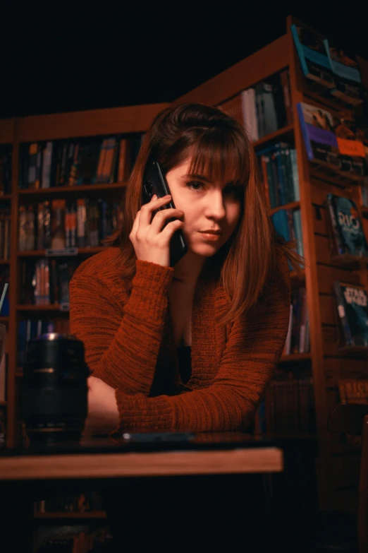 a woman holding a cell phone to her ear