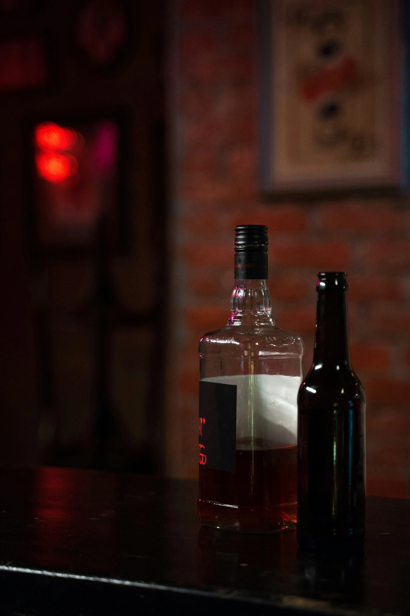 a bottle and a liquor bottle sitting on a table