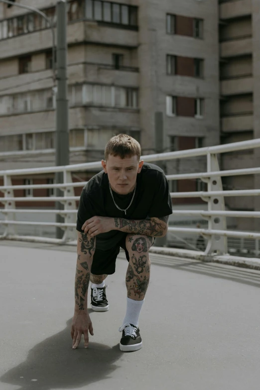 a person leaning on a skateboard in front of tall buildings