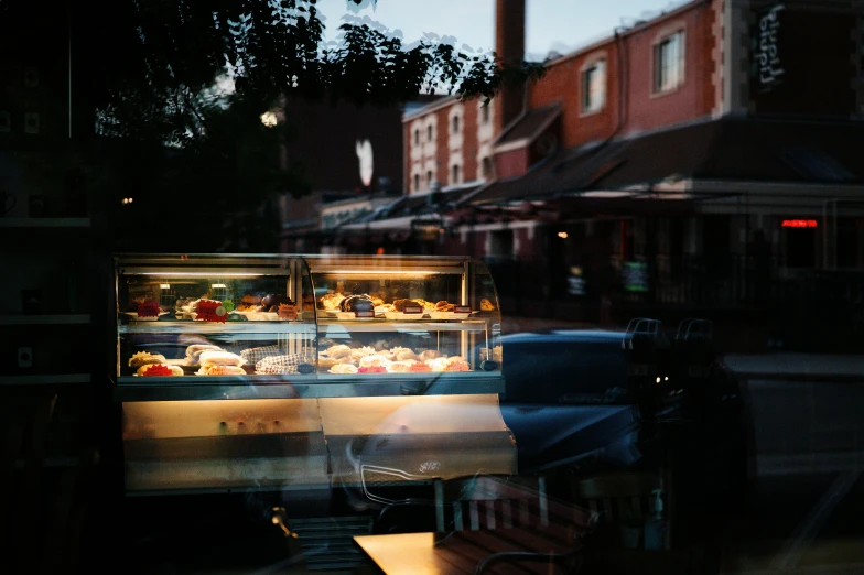 food display with blurred image looking towards the outside