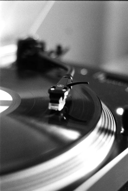 an image of a record player playing music on a turntable