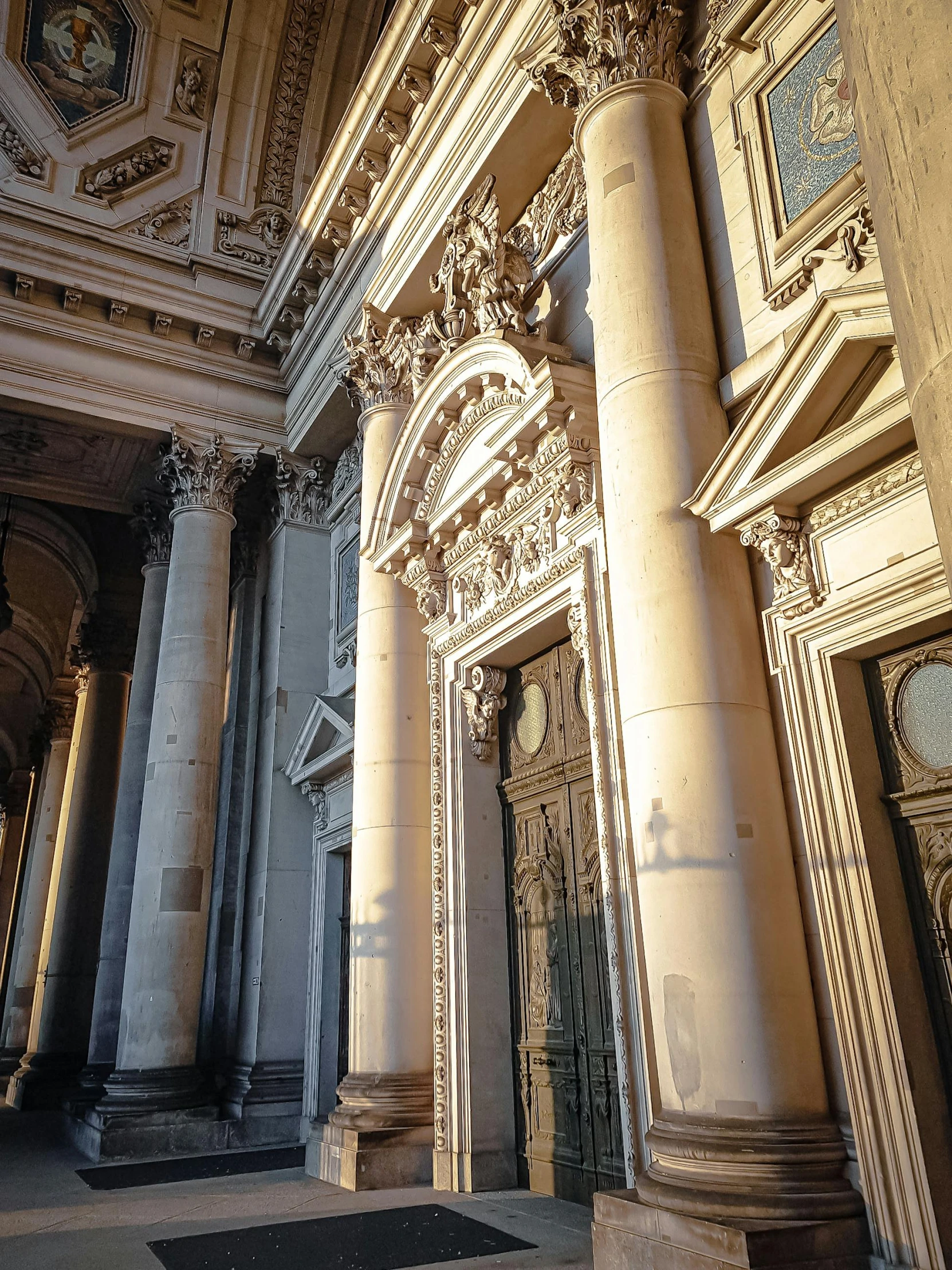 an old building with pillars and large columns in it