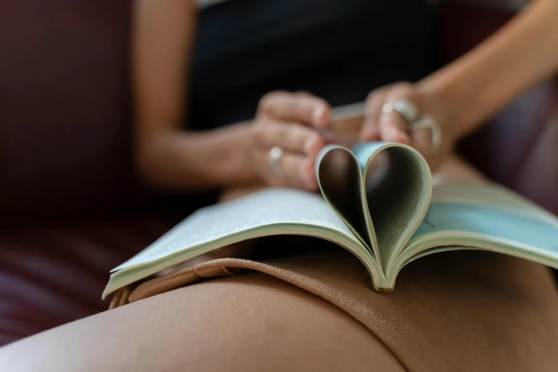 a book with a heart - shaped page open