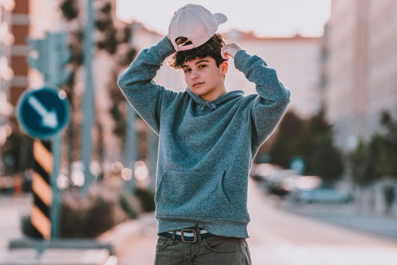 a man in a hat on a city street