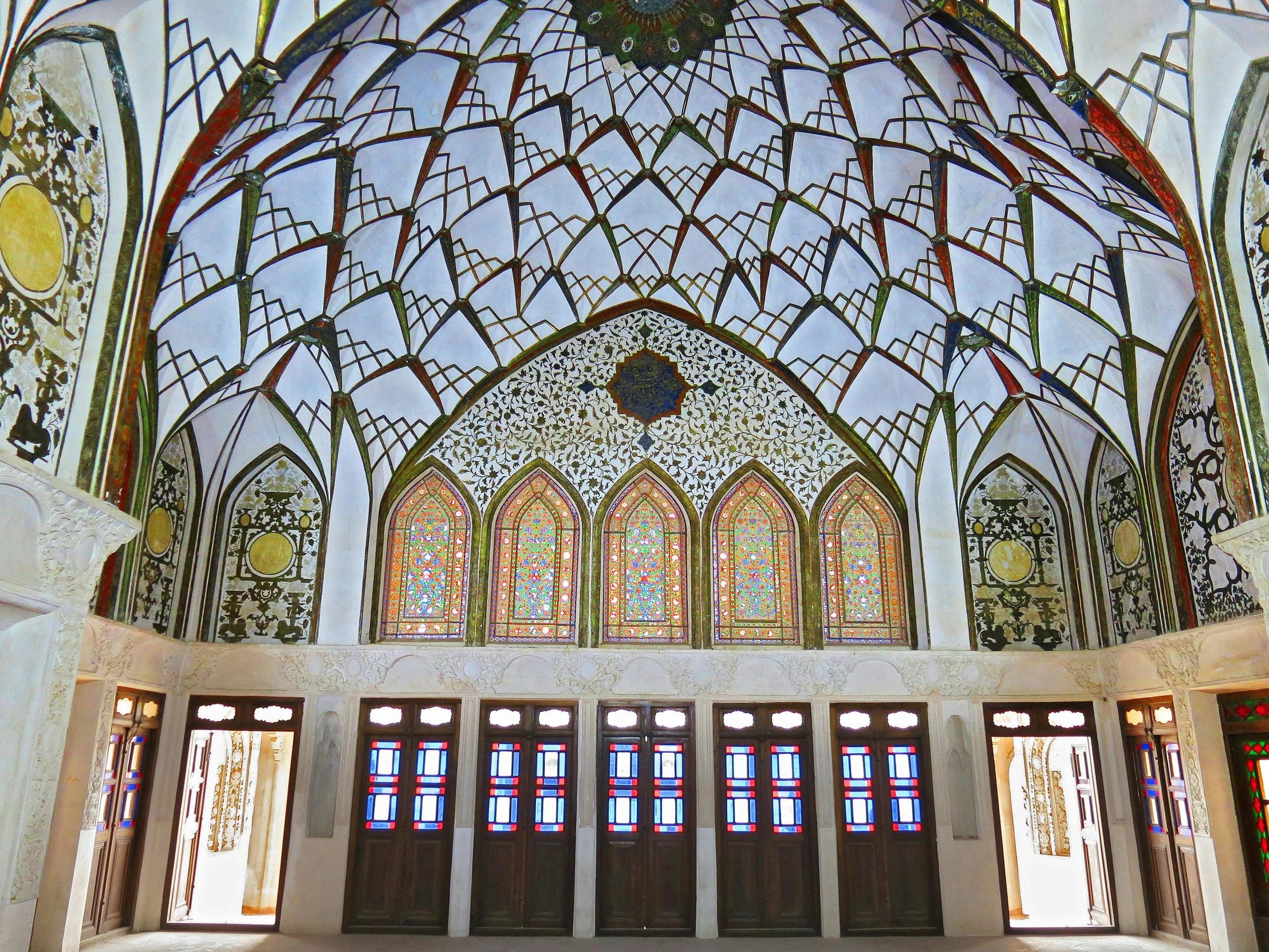 a cathedral with stained glass windows and stained doors