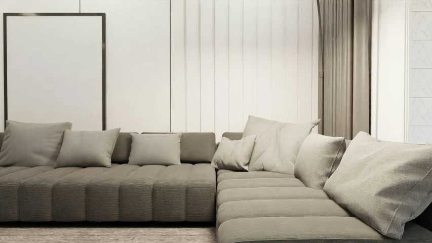 a sectional sofa with many pillows sitting on top of it