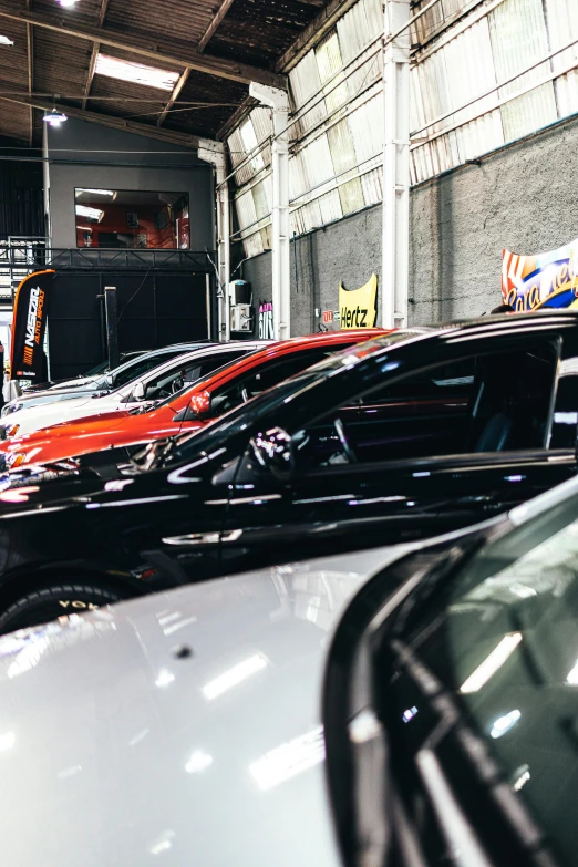 the inside of a building filled with cars