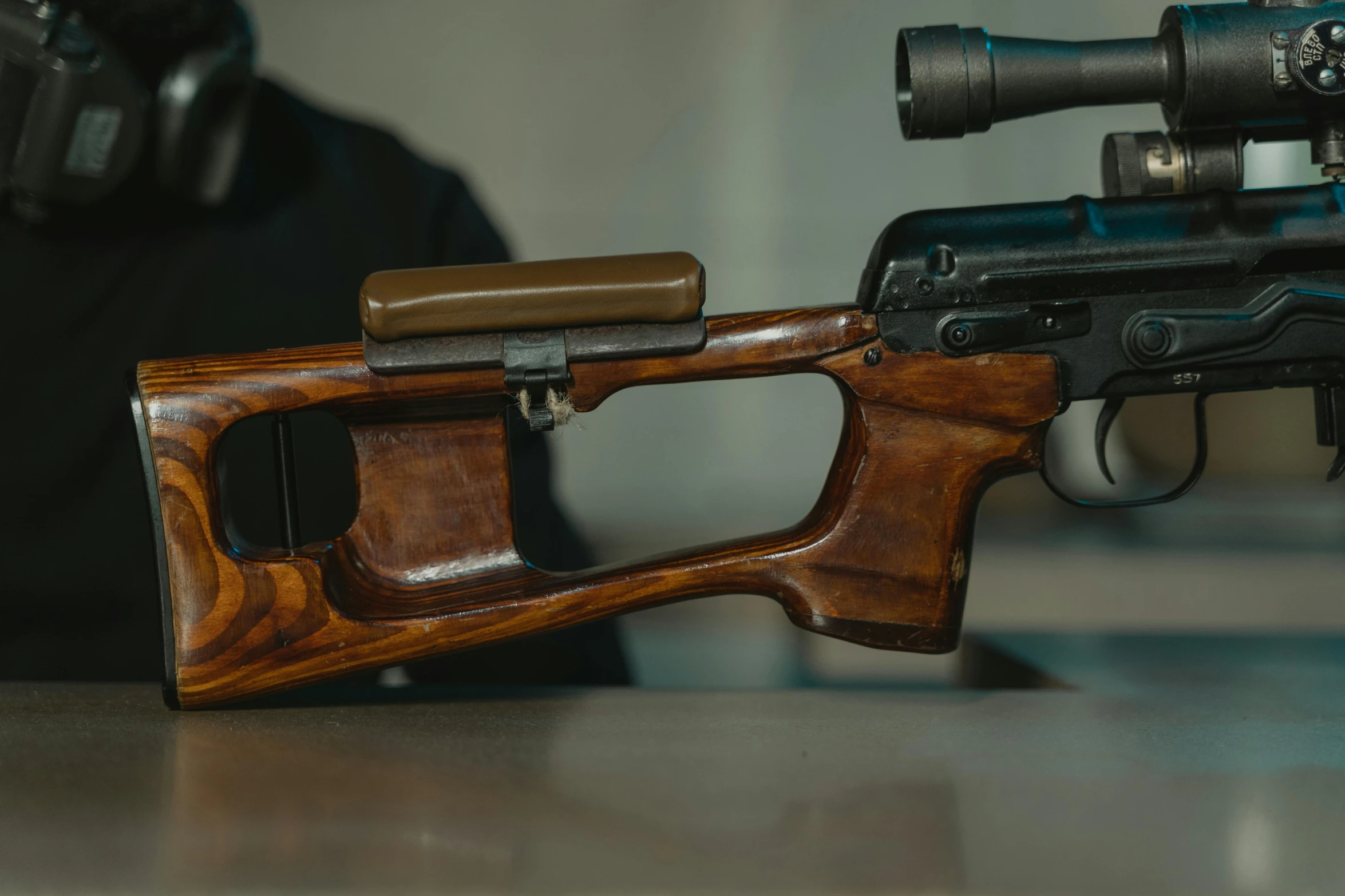 two different types of weapons sit on a table