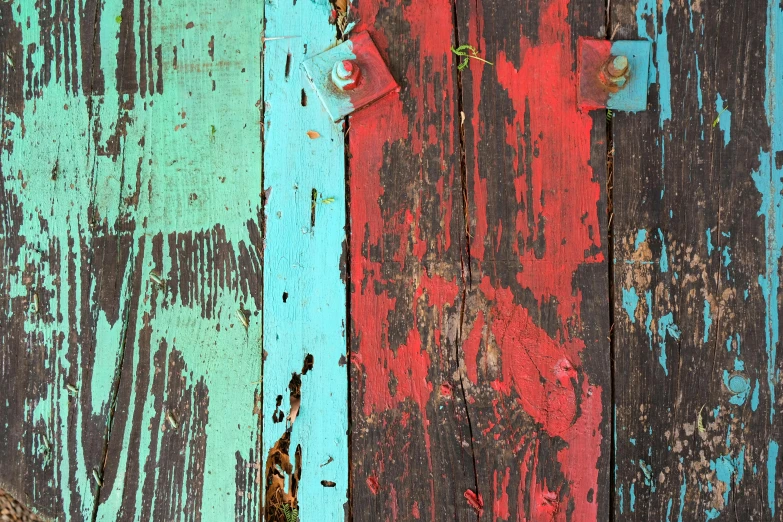 two wooden boards have been painted red and blue