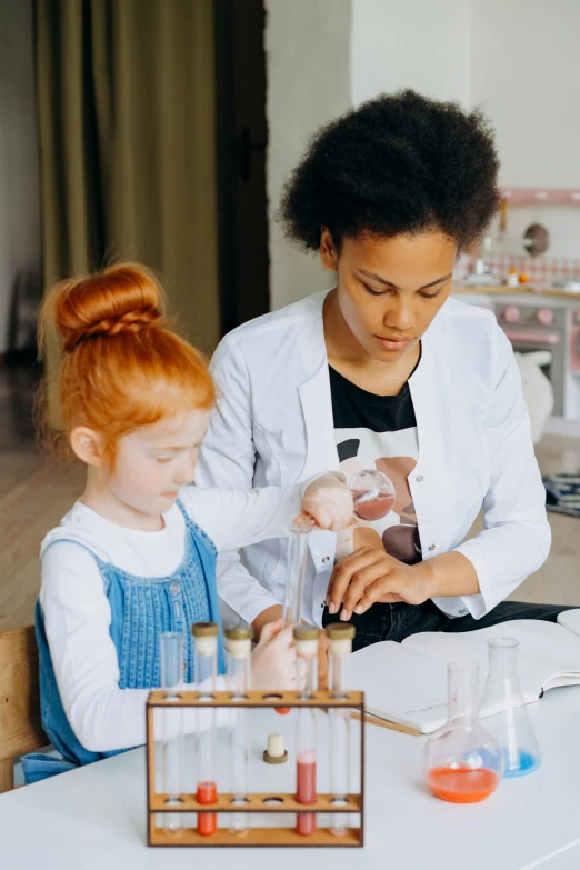 woman showing  how to make an experiment with science equipment