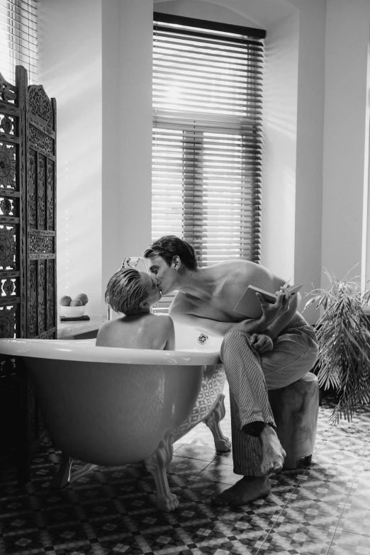 a couple relaxing in a bathtub in a house