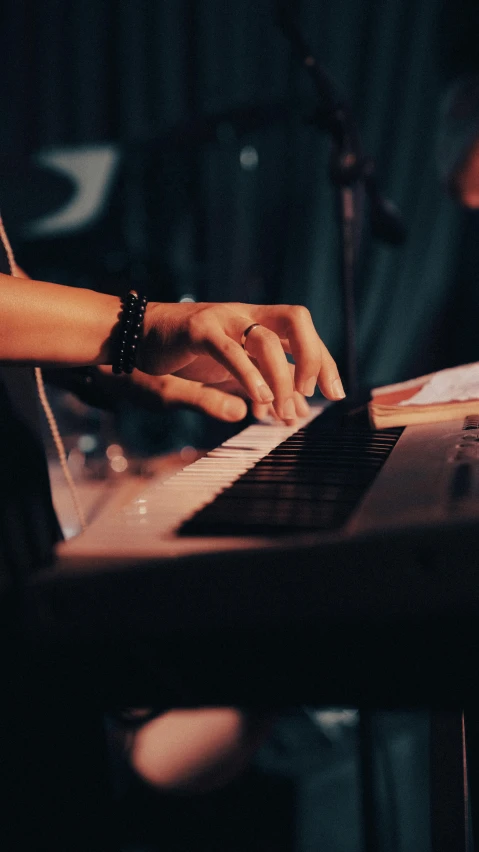 hands are typing on the keyboard of a computer