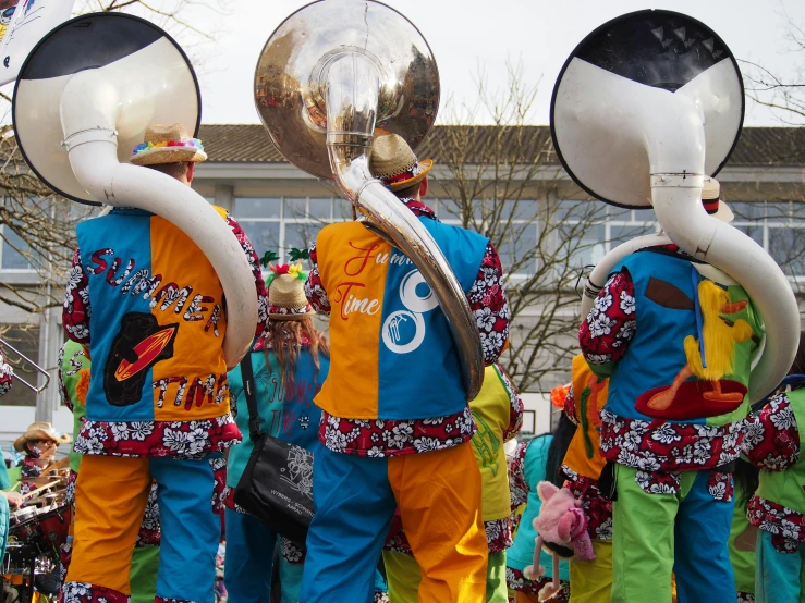 two guys in the street with large mirrors in their ears