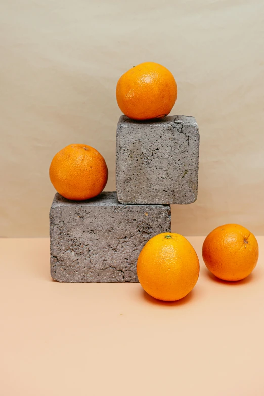 three oranges stacked on top of one another