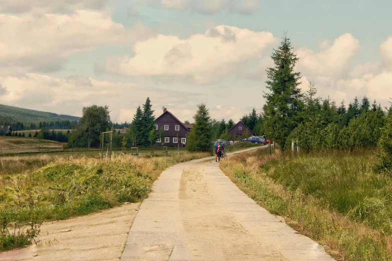 two people are riding their bikes on the trail