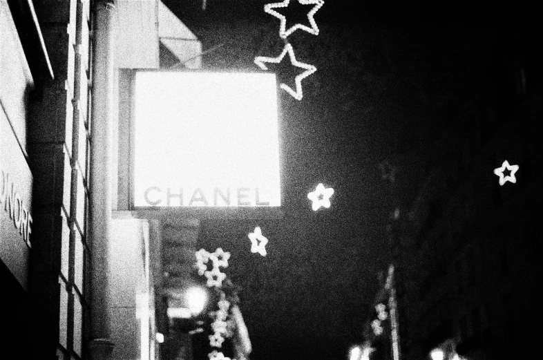 a view of the corner from the street light at night