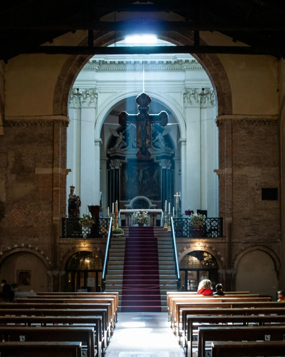 the view of a church from the back and on the stairs