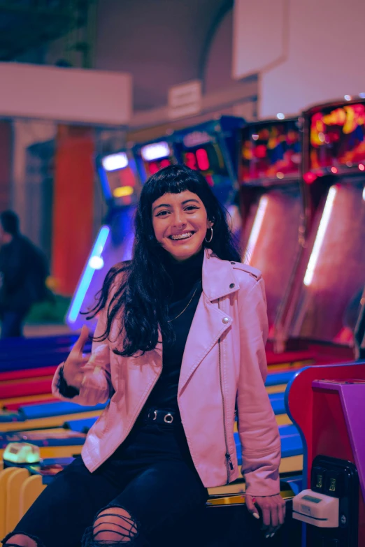 the woman smiles as she rides her toy machine