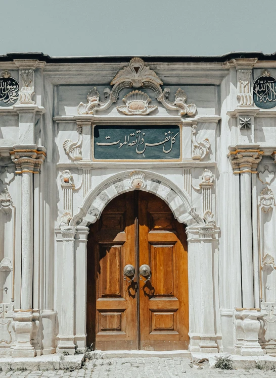 two large wooden doors in front of a building