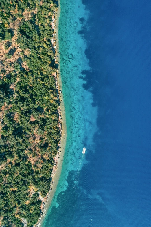 an aerial view of a tropical blue ocean