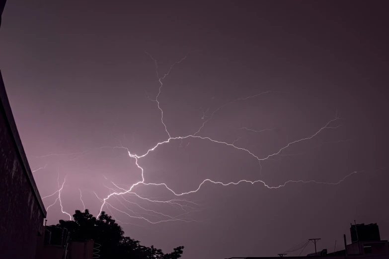 a sky full of lightning is shown with dark clouds