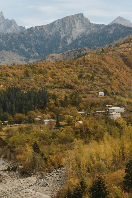 an image of a mountain scene that looks like it is autumn