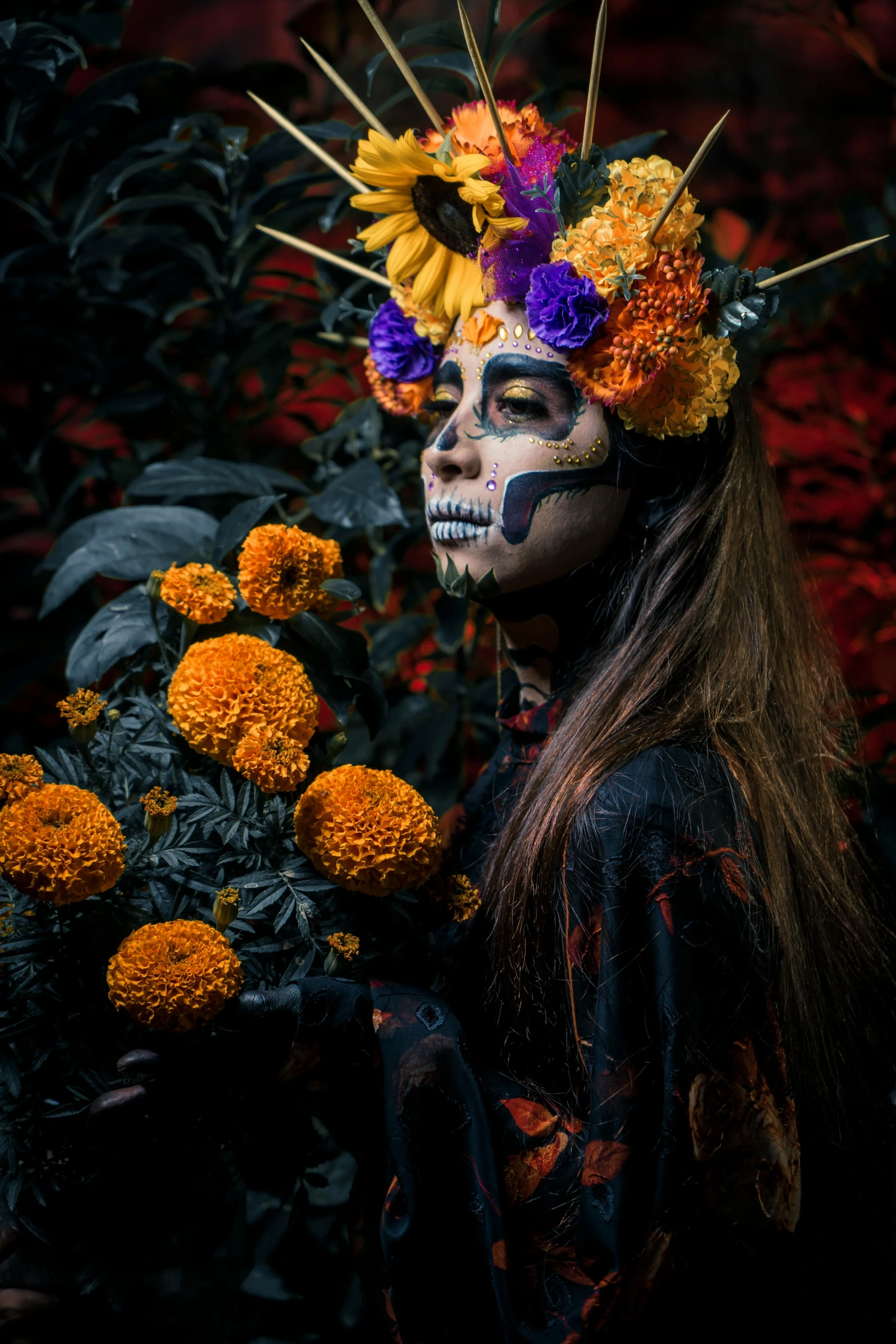 a woman wearing makeup holds flowers in front of her face