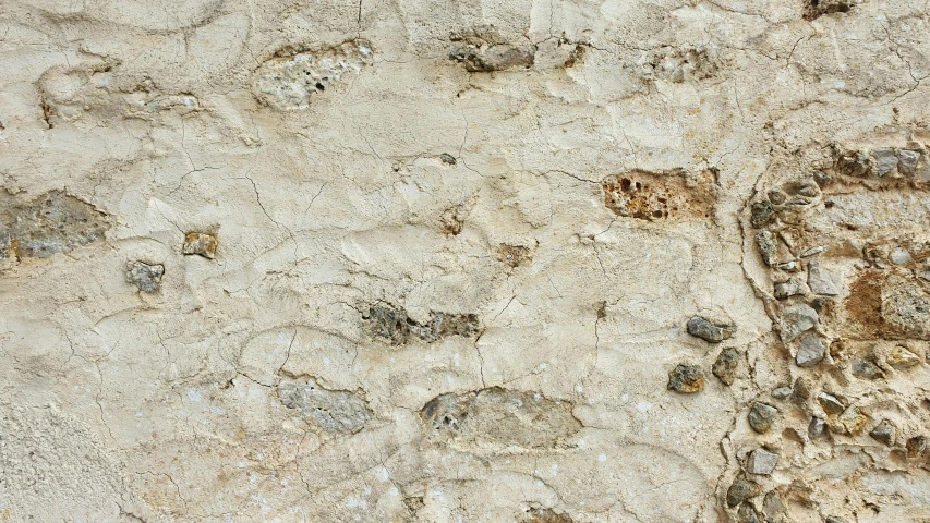 the background of a cement surface with small holes in it