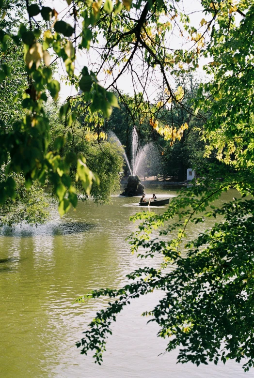 people in a boat are traveling down the river