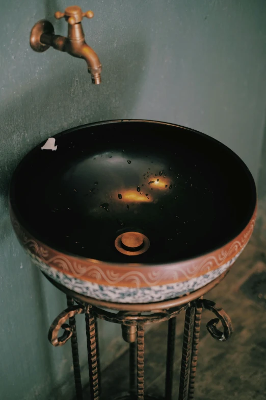 an ornate bathroom sink with a faucet