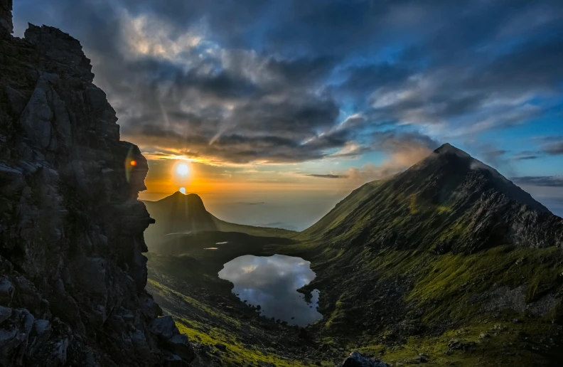 a very strange looking mountain with a lake near it