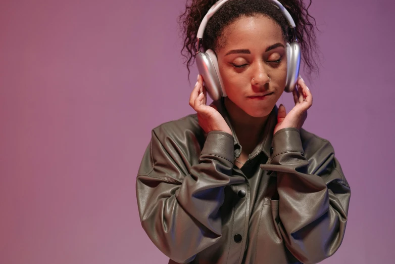 a person in a leather jacket wearing headphones