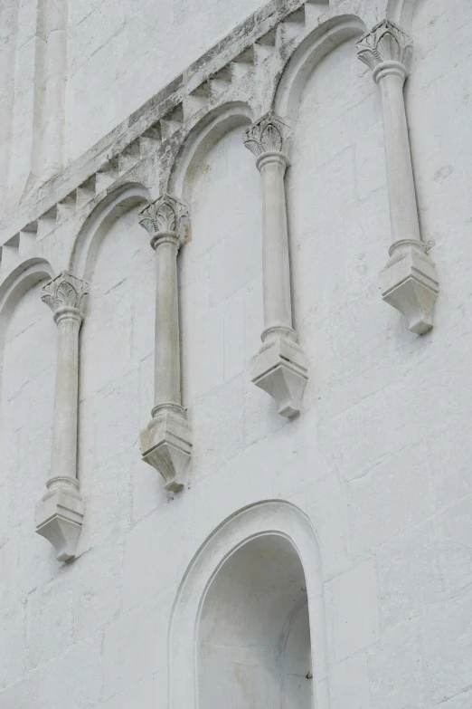 a cathedral with tall arched windows and pillars