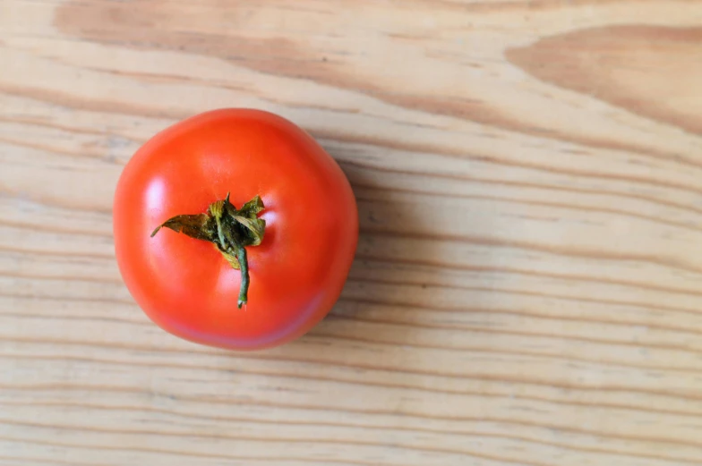 the tomato has a bite taken out of it