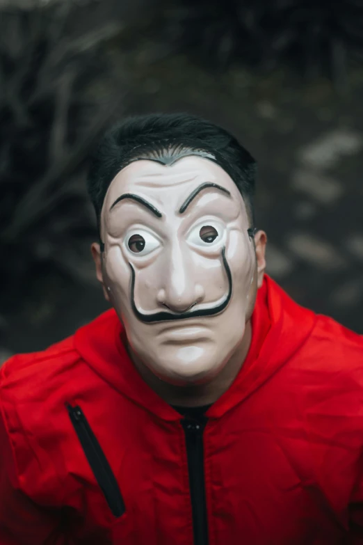 a guy with a creepy mask and mouth painted on his face