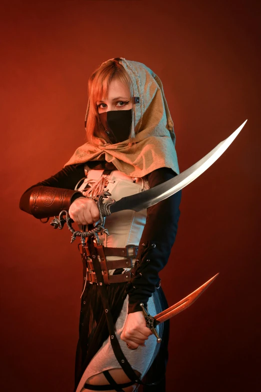 the woman with the sword has two knives on her shoulder