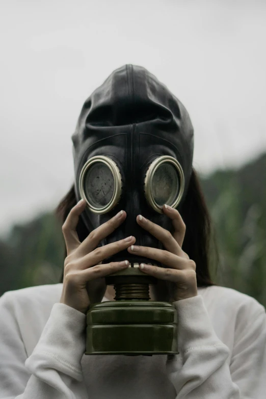 a man with two pair of binoculars on his face